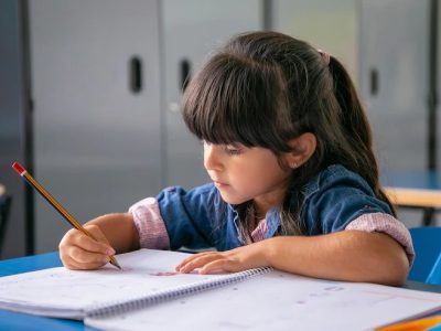 pensive-haired-latin-girl-sitting-school-desk-drawing-her-copybook_74855-16416 (1)