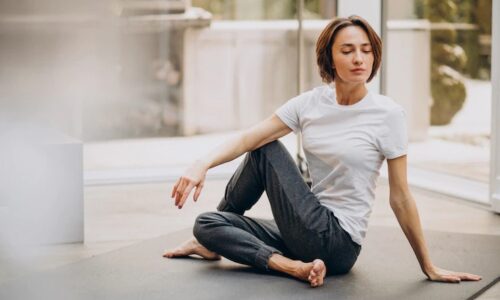 young-woman-practicing-yoga-home_1303-20240